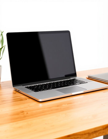 Laptop with blank screen on a wooden desk, isolated on white background