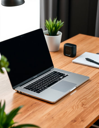 laptop with blank screen on wooden table in modern office, closeupの写真素材