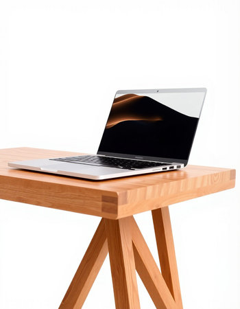 Laptop on wooden table isolated on white background with clipping path.の写真素材