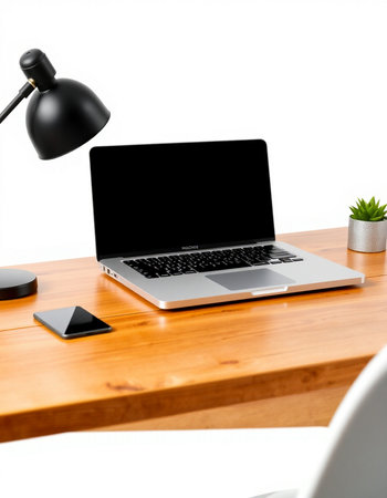 Close up view of modern workplace with blank black laptop screen on wooden desk isolated on white backgroundの写真素材