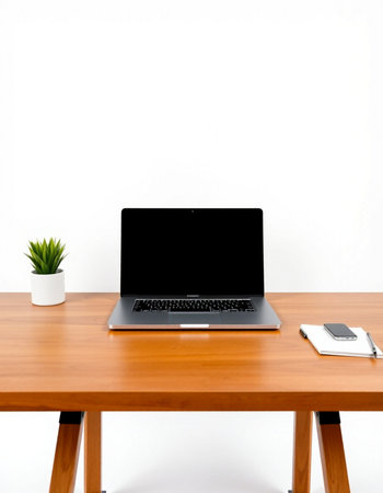 Laptop computer on wooden table with white wall background, stock photoの写真素材