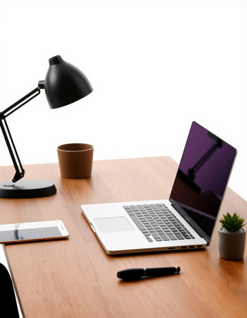 workplace with laptop, tablet and coffee cup on wooden table isolated on whiteの写真素材