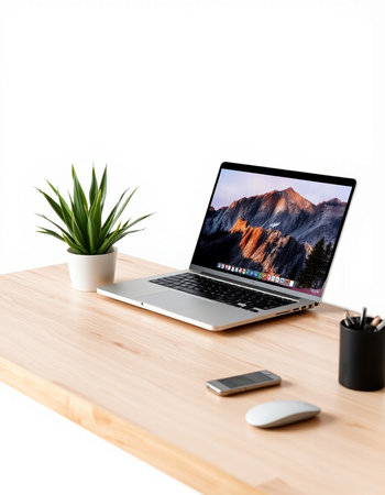 Workplace with modern laptop and coffee cup on wooden table over white backgroundの写真素材