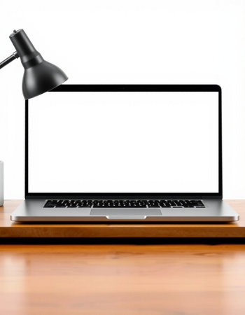 Laptop computer with blank screen on wooden table and white wall background