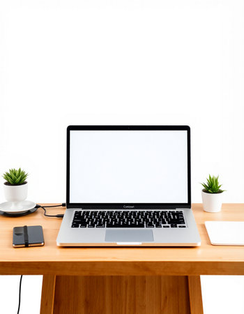 Laptop with blank screen on wood table and white wall background.の写真素材