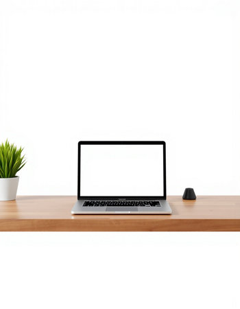 Laptop computer with blank screen on wooden table isolated on white background