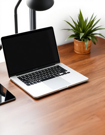 Laptop with blank screen on wooden table in office, mockup