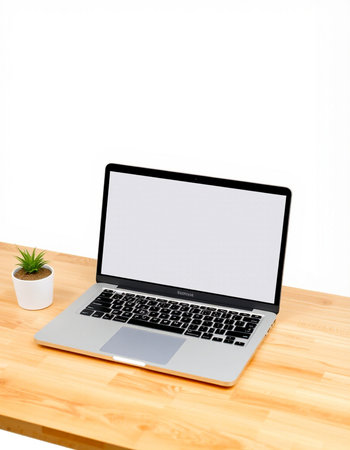 Laptop with blank screen on wooden desk isolated on white background.