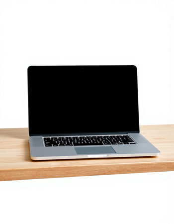 Laptop on the wooden table. Isolated on white background.の写真素材