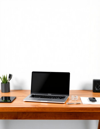 Laptop with blank screen on wooden table near white wall. Mock up