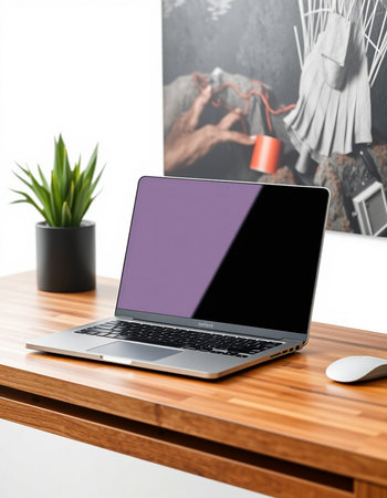 Laptop with blank screen on wooden table in modern office. Mock upの写真素材