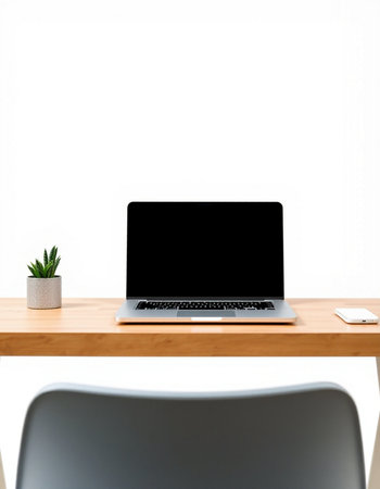 Mockup laptop with blank screen on wooden table in office roomの写真素材