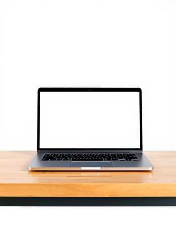 Laptop computer with blank screen on wooden table isolated on white backgroundの写真素材