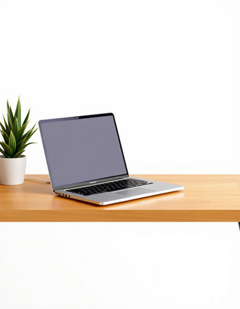Laptop computer on wooden table isolated on white background with clipping path