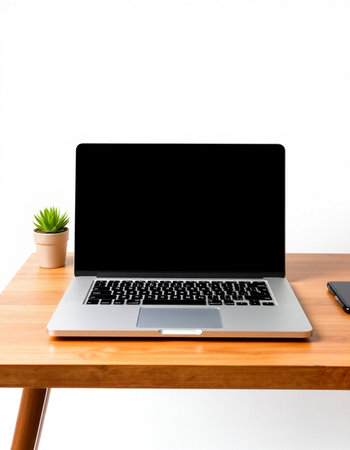 Laptop computer with blank screen on wooden desk isolated on white background