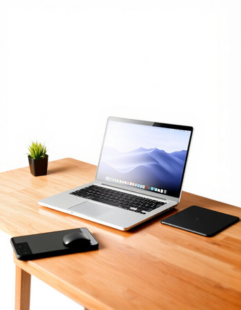 Modern workspace with laptop, smartphone and coffee cup on wooden table over white background