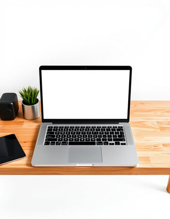 Modern workspace with blank screen laptop computer, smartphone, coffee cup and plant on wooden...
