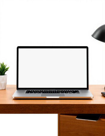Laptop with blank screen on wooden desk isolated on white background.