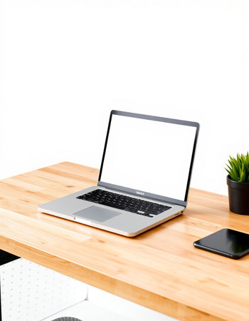 Laptop with blank screen on wooden desk isolated on white background.