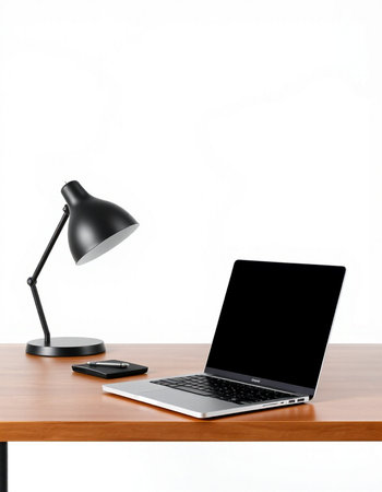 Laptop and lamp on a wooden table isolated on white background.