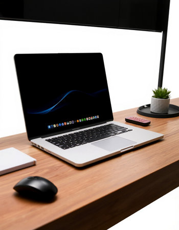 Laptop on wooden desk with keyboard and mouse, isolated on white
