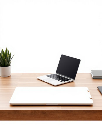 Laptop computer with blank screen on wooden table isolated on white backgroundの写真素材