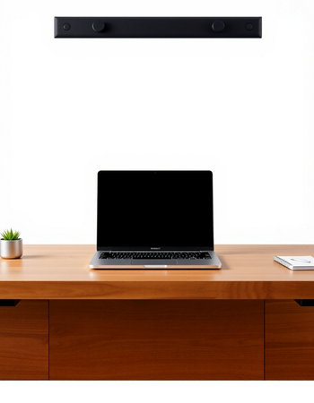 Laptop with blank screen on wooden desk isolated on white background.の写真素材