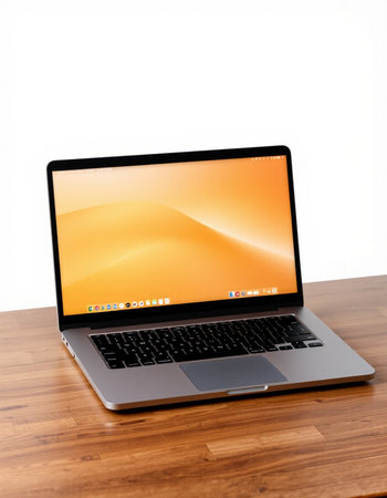 Laptop on wooden table with white background, clipping path included.