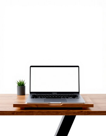 Laptop with blank screen on wooden desk isolated on white background.