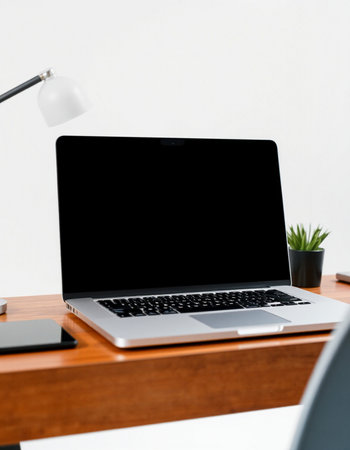 Laptop with blank screen on wooden desk at home office. Mock upの写真素材