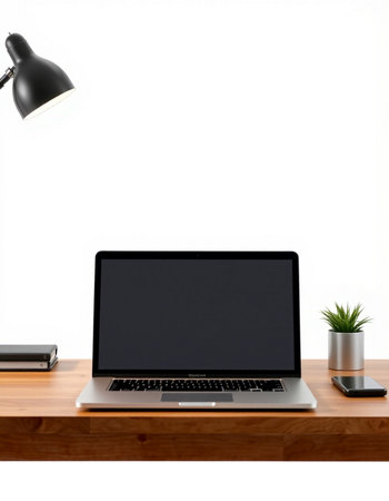 Laptop with blank screen on a wooden desk isolated on white background