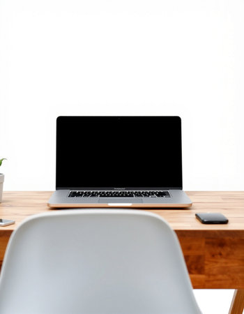 Laptop with blank screen on wooden table and white chair isolated on white backgroundの写真素材