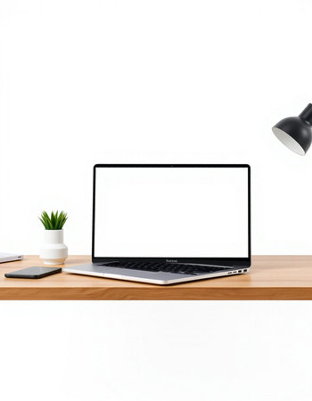 Laptop with blank screen on wooden table isolated on white background.