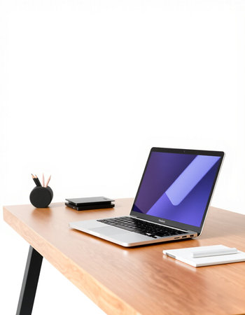 Modern workspace with blank laptop, stationery and coffee cup on wooden table isolated on white backgroundの写真素材