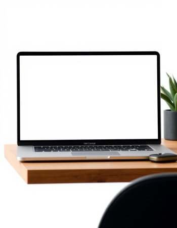 Laptop with blank screen on wooden desk isolated on white background.の写真素材