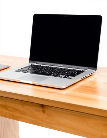 Laptop computer on wood desk isolated on white background with clipping path