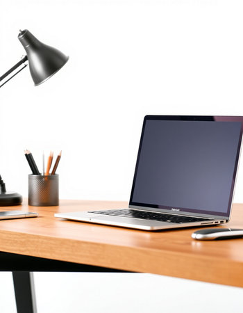 Close up of modern workplace with blank screen laptop, stationery and coffee cup on wooden table