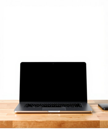 Laptop with blank screen on wooden table isolated on white background.