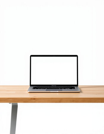 Laptop computer with blank screen on wooden table isolated on white background