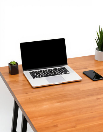 Laptop on wooden table. Workplace with blank screen laptop.の写真素材