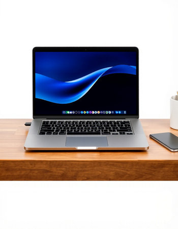 Laptop on a wooden table with a cup of coffee on a white background