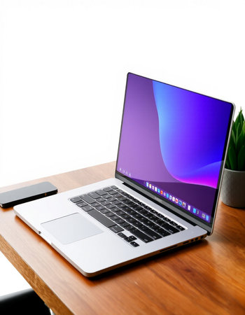 Laptop on wooden table with white background, clipping path included.