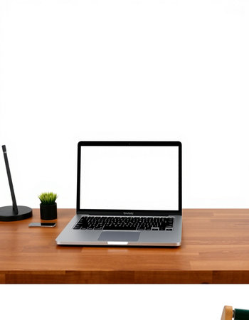 Laptop with blank screen on wooden desk isolated on white background.