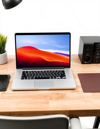 Workplace with laptop, tablet and other objects on white background.