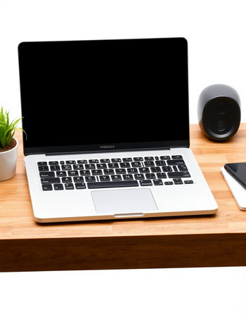 Laptop with blank screen on wooden desk isolated on white background