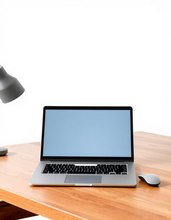 Laptop computer with blank screen on wooden desk isolated on white background