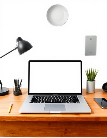 Close up of modern designer workspace with laptop, coffee cup and other items on wooden table