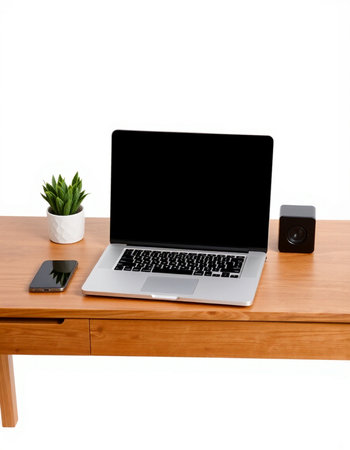Laptop with blank screen on wooden desk isolated on white background.