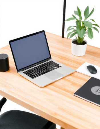 Modern workplace with laptop on wooden table and white background, clipping path