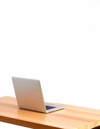 Laptop computer on a wooden desk isolated on white background with clipping path